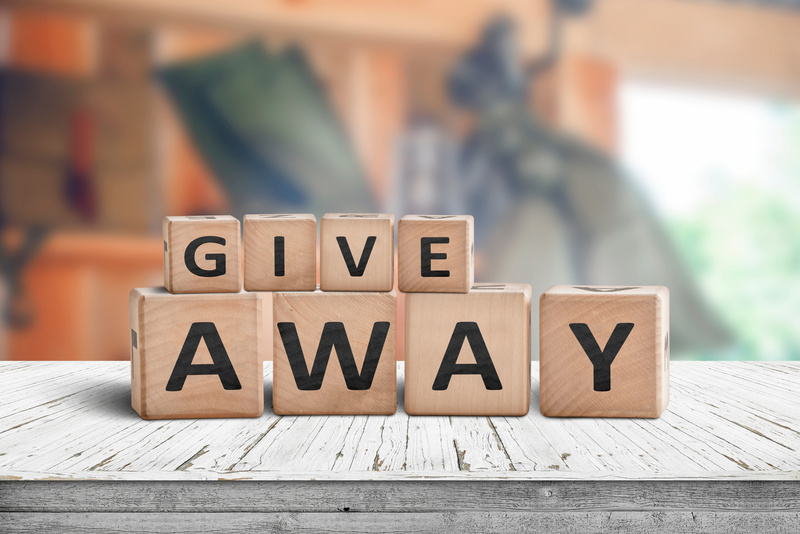 Give away contest sign on a wooden desk
